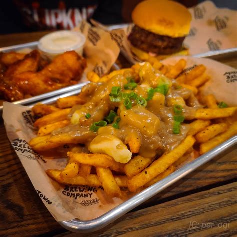 Poutine With A Side Of Wings And Burger At Morgantown Brewing Company