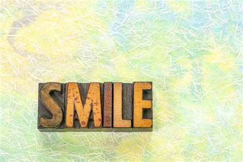 Smile Word Written In Cube On Wooden Floor On White Background Stock