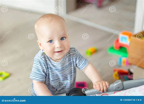 Portrait Of Cute Baby Boy Playing With Toys At Nursery Adorable Kid