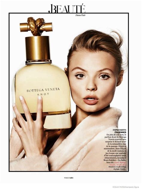 Magdalena Frackowiak Poses With Fragrance Bottles For Vogue Paris By