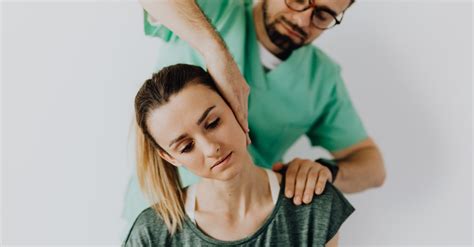 Focused massage therapist doing neck massage on woman · Free Stock Photo