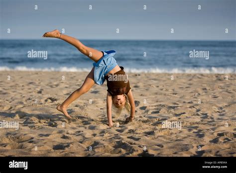 Young Girl Doing A Handstand On The Beach Stock Photo Alamy