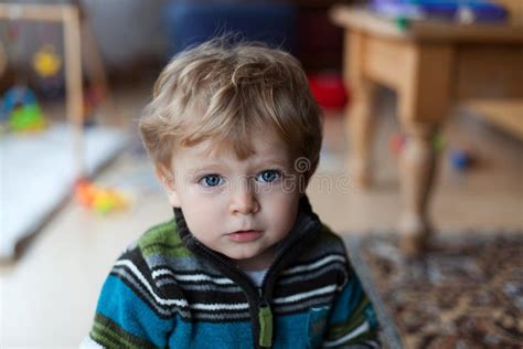 Adorable Baby Boy With Blue Eyes And Blond Hairs Stock Photo Image Of