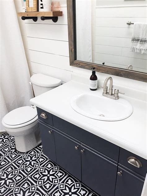I have finally finished painting the bathroom cabinets and am excited to show them to you! Bathroom Update + How to Paint Laminate Cabinets — The ...