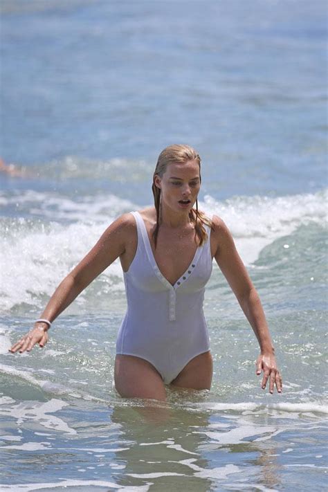 Wipe Out Margot Robbie Takes A Tumble Surfing In See Through White
