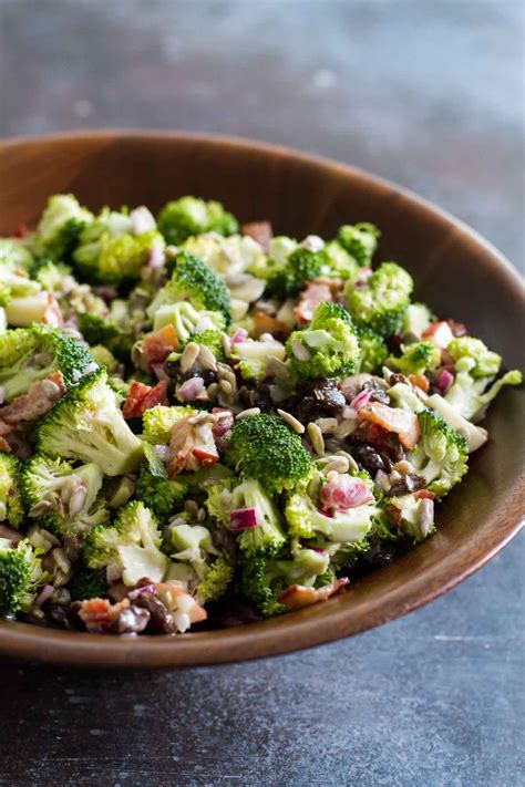 Combine and toss broccoli, nuts, raisins, apples, and grapes. Classic Broccoli Salad Recipe with Bacon - Taste and Tell