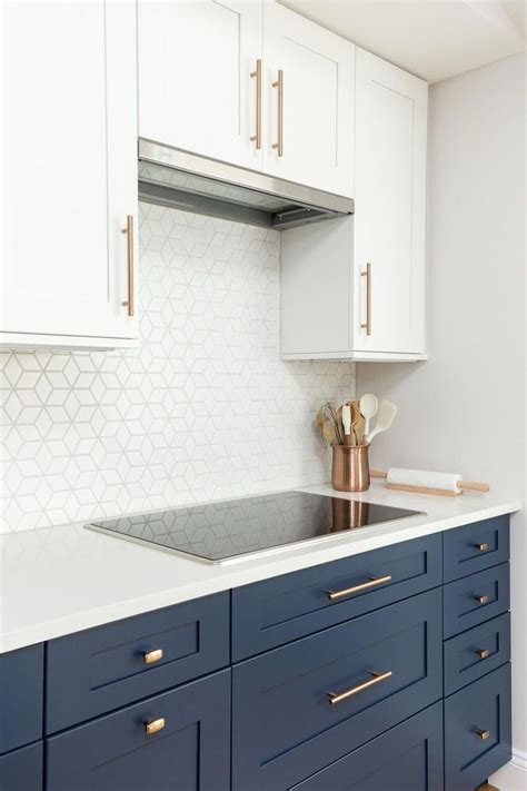 White shaker kitchen cabinets with quartz countertops. Kitchen with new white & navy shaker cabinets, white ...