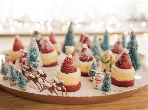 One dark one white, that are topped with crushed candy canes. Cheery Cheesecake Santa Hats Recipe | Ree Drummond | Food ...