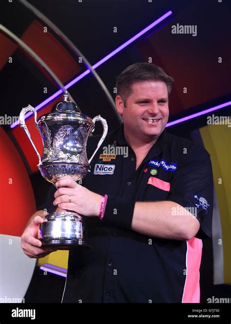 Scott Mitchell Celebrates With The Trophy After Defeating Martin Adams During The BDO