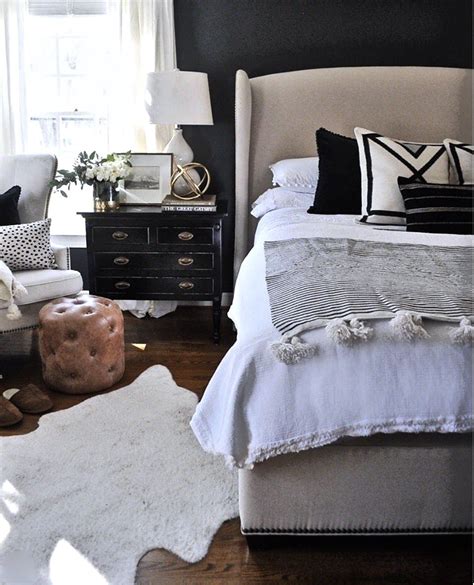 For a feminine bedroom, there are three great colors that will enhance the space and make it a woman's ideal. masculine dark colors+leather/ feminine gold+pompoms ...