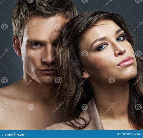 Attractive Couple Of A Girl And Shirtless Muscular Male Have Fun With A