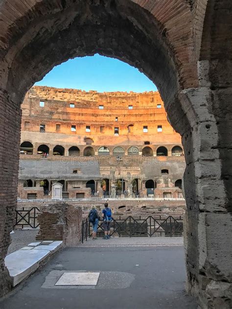 Tourists Inside The Colosseum Viewed Through Arch Rome Italy