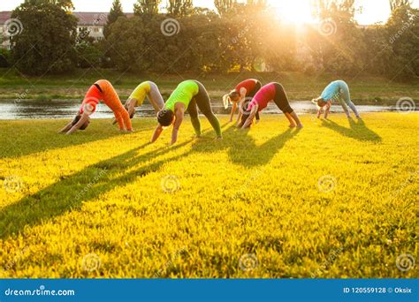 Active Women Practicing Yoga Outside Stock Photo Image Of Adult