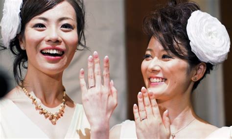 Koyuki Higashi And Her Partner Hiroko Smile As They Show Their Marriage
