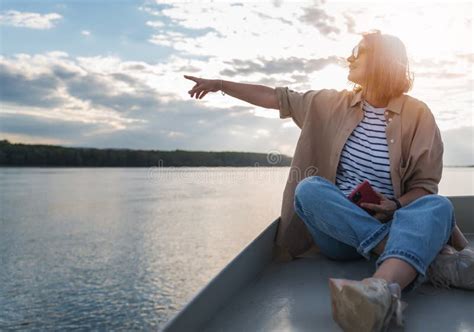 Young Adult Caucasian Happy Woman Relaxing On A Boat On The River