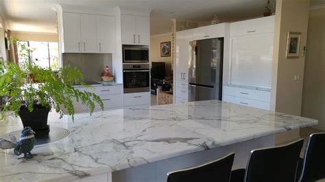 Carrara Marble Laminate Benchtops With White Two Pack Cabinets