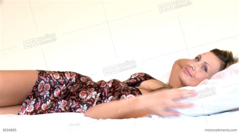Elegant Woman Lying Down On Bed Stock Video Footage 3694885