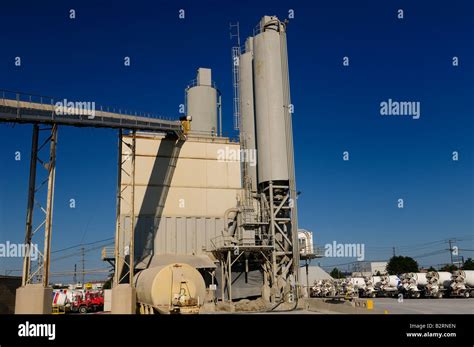 Toronto cement factory kiln and silos with waiting cement trucks with
