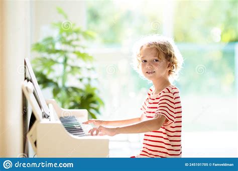 Child Playing Piano Kids Play Music Stock Image Image Of Mother