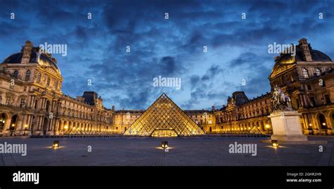 Panorama Of The Museum And Pyramid Of Le Louvre Illuminated At Night In