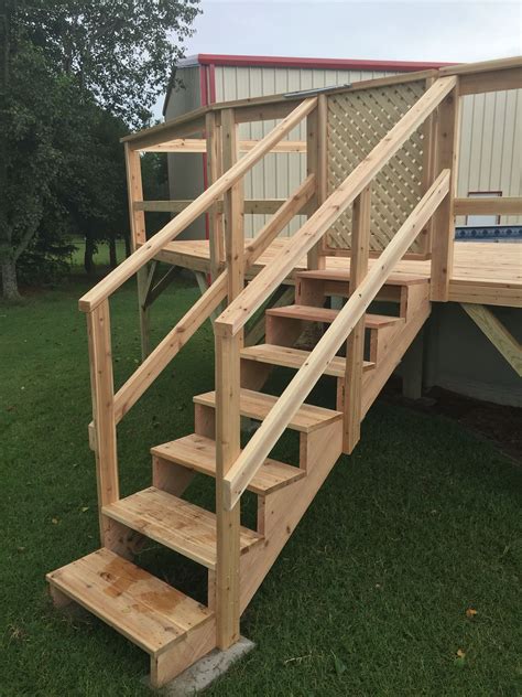 A Set Of Wooden Stairs In The Grass