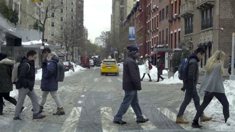 Dolly Shot Rear View Two Men Walking Down City Block Stock Footage