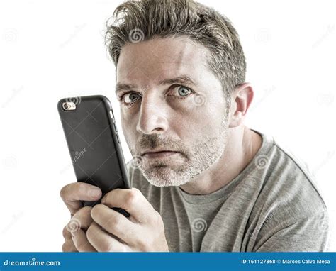 Freak And Weird Looking Man Using Mobile Phone Watching Something