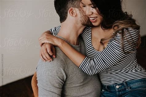 Attractive Young Interracial Couple In Trendy Loft Apartment By Stocksy Contributor Jess