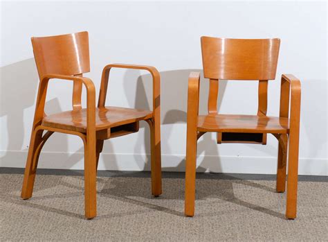 The bent plywood armchair, introduced in 1934, is crafted from a single piece of molded plywood. An Unusual Pair of Bent Plywood Arm Chairs by Thonet at ...