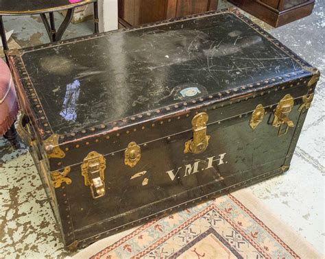 Steamer Trunks Three Early 20th Century Black And Brass Mounted With