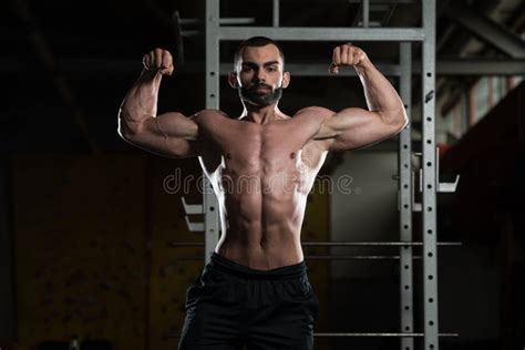 Bodybuilder Flexing Front Double Biceps Pose Stock Image Image Of Abdominal Effort 73112619