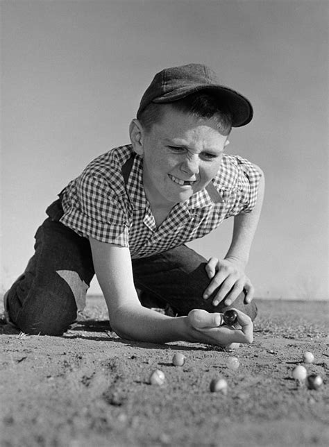 Boy Shooting Marbles C1950 60s Photograph By B Taylorclassicstock