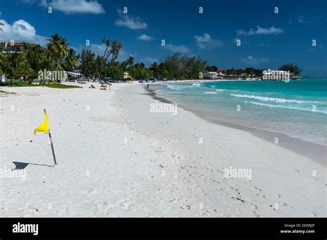 yellow flag on accra beach on the south coast of the caribbean island of barbados in the west