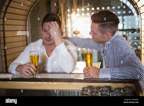 Man Comforting His Depressed Friend Stock Photo Alamy