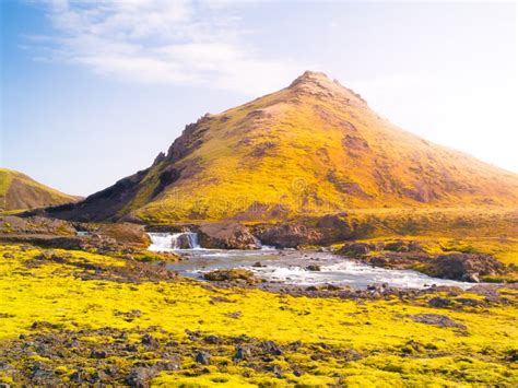 Green Hilly Landscape Of Iceland Highlands With Glacier River Around