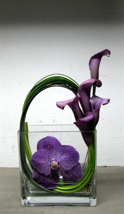 Common purple flowers in arrangements. Purple calla lilies arrangement … | Flower arrangements ...
