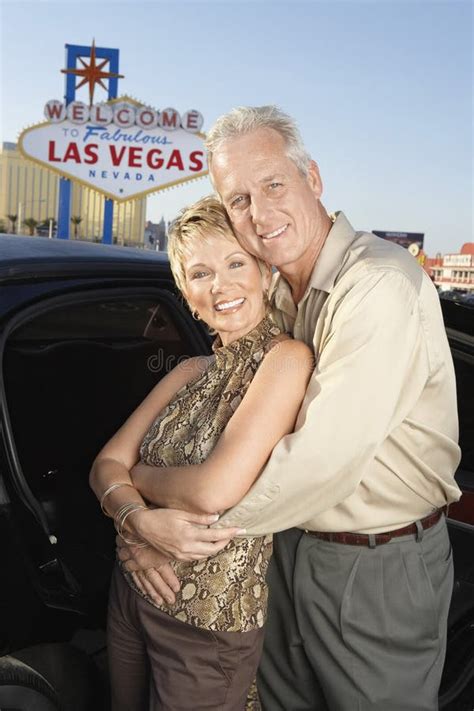 Loving Couple In Front Of Welcome To Las Vegas Sign Stock Photo Image