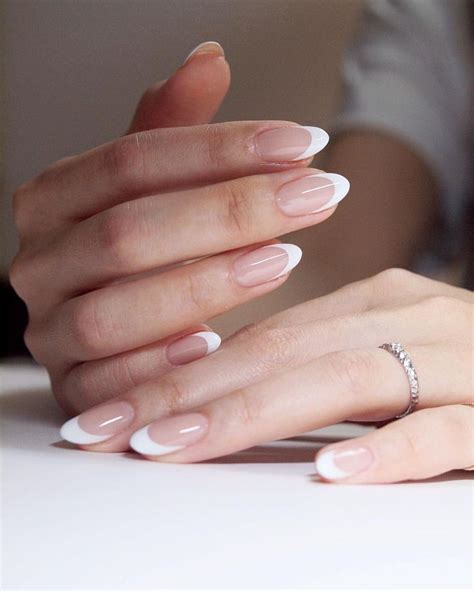 If you don't want the hassle of fake nails, you. Clean white French oval nails murakaminails | Manicures ...