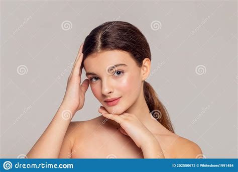 Beautiful Young Woman With Clean Fresh Skin Touch Own Face Stock Image