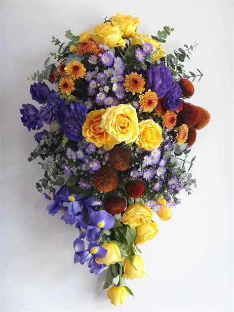 Multi award winning independent florist in gravesend kent, specialists in bespoke funeral tributes and wedding flower arrangements. Teardrop Funeral Spray in Cold-Warm Contrast - Yellow Rose ...