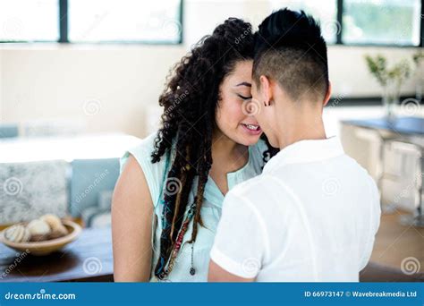 Romantic Lesbian Couple Standing Face To Face And Holding Hands Stock Image Image Of Bonding