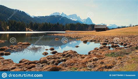 Idyllic Moor Lake Geroldsee View To Wetterstein Mountains And Hay Hut Bavarian Landscape Stock