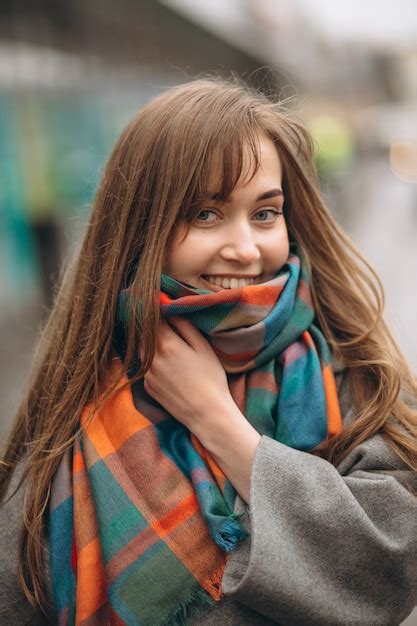 premium photo portrait of a girl in coat and scarf