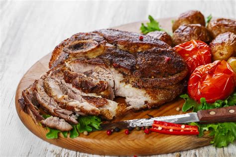 Which should you go for? Roasted Pork Shoulder On The Bone Stock Photo - Image of meal, scapula: 49631022