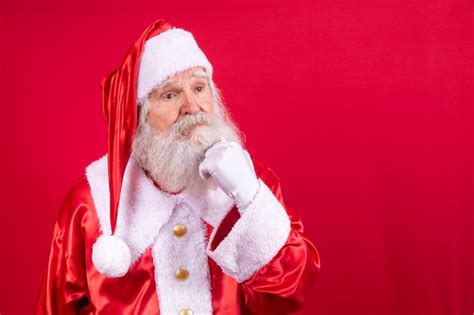 Premium Photo Thoughtful Santa Claus On Red Background Real Santa