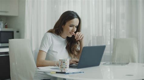 Portrait Of Young Woman Working On Laptop In Stock Footage Sbv