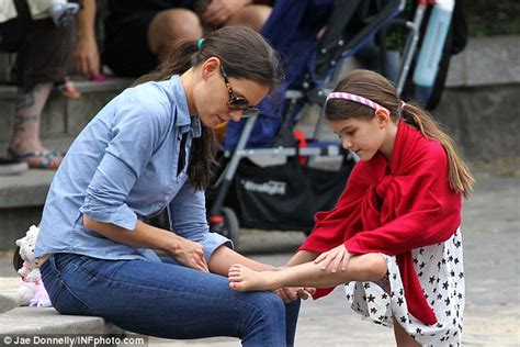 Suri Cruise Enjoys A Ride On The Carousel With Katie Holmes As She