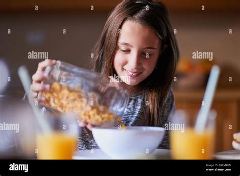 She Loves Cereal For Breakfast Lunch And Dinner Cropped Shot Of A