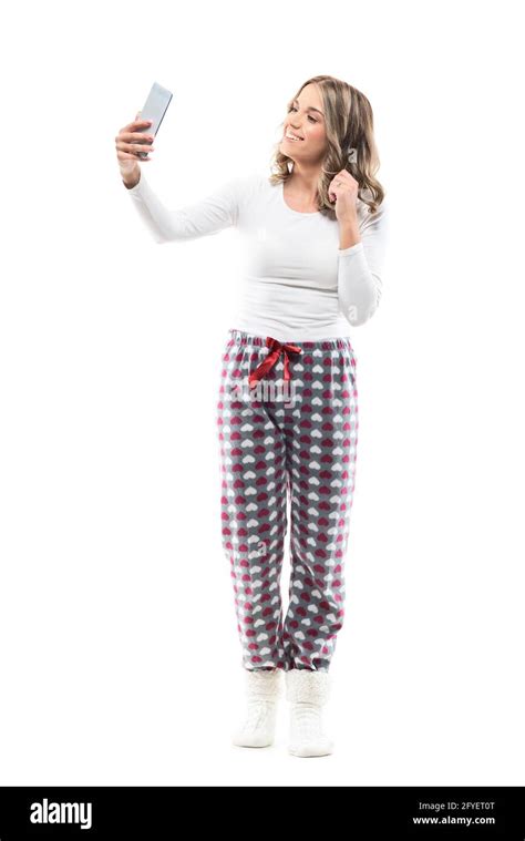 Beautiful Young Woman In Pajamas Taking Self Portrait Photos With Cell Phone Full Body Length