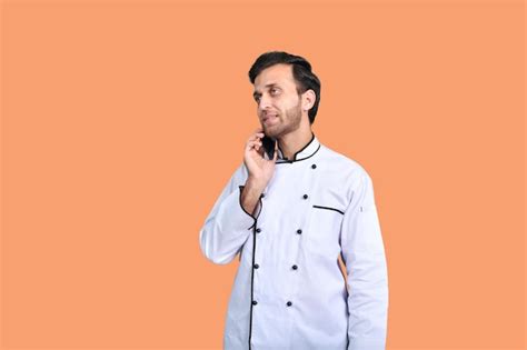 Premium Photo Handsome Chef Talking On Phone White Outfit Indian Pakistani Model